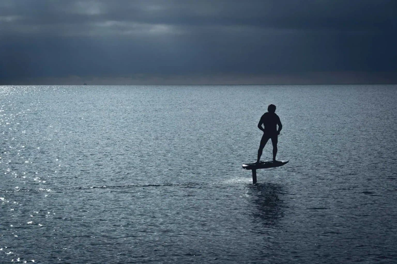 A rider carving a turn on an eFoil