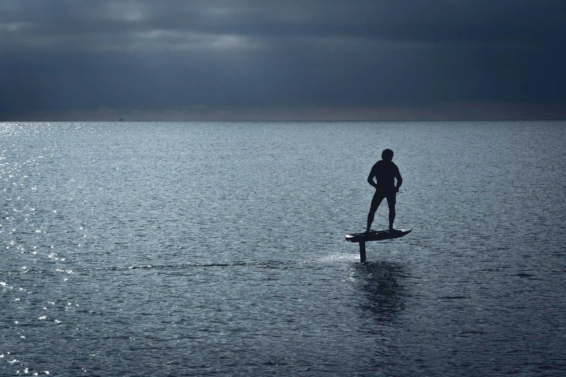 A rider carving a turn on an eFoil